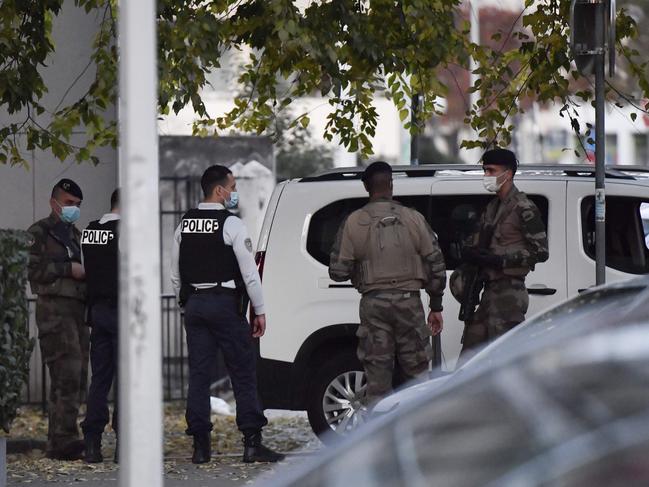 Security and emergency personnel at the scene of the shooting in Lyon. Picture: AFP