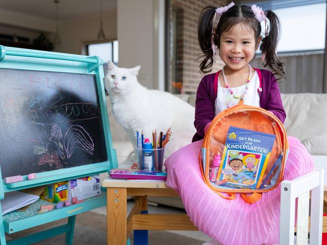 Eloise Ho can write her name and loves reading, but her passion for learning isn’t enough for her to be allowed to start school next year. Picture: Jason Edwards