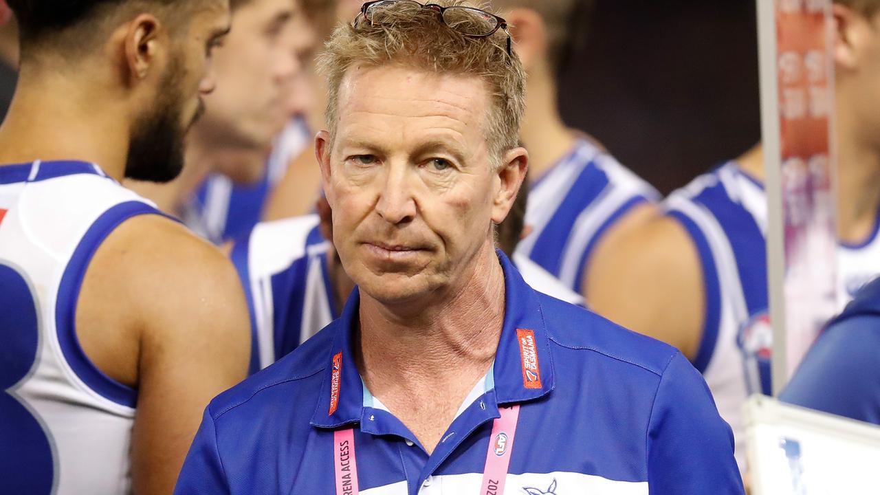 North Melbourne coach David Noble walks away from a huddle.