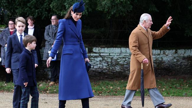 Princess Catherine, with Princes George (left) and Louis, as King Charles III waves to well-wishers after attending the royal family's traditional Christmas Day service at St Mary Magdalene Church on the Sandringham Estate. Picture: AFP