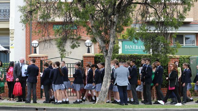 Mourners outside the funeral service. Picture: Britta Campion