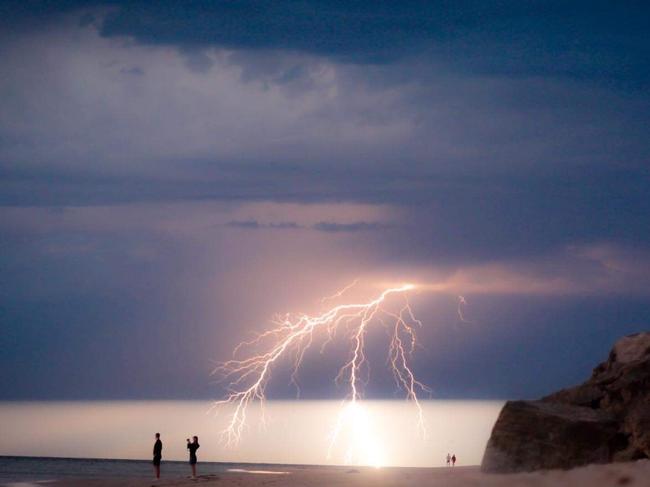 Daring photographers were out capturing Thursday’s lightning storm from, Brighton beach. Picture: Tania Verbeeck