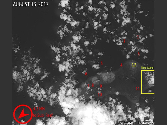 An AMTI/CSIS satellite photo showing the Chinese naval and fishing fleet clustered around a sandbar near the Philippine-occupied island of Thitu.