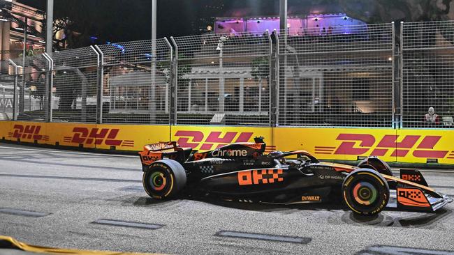 McLaren's Australian driver Oscar Piastri drives during the first practice session for the Singapore Formula One Grand Prix night race at the Marina Bay Street Circuit in Singapore on September 15, 2023. (Photo by Lillian SUWANRUMPHA / AFP)