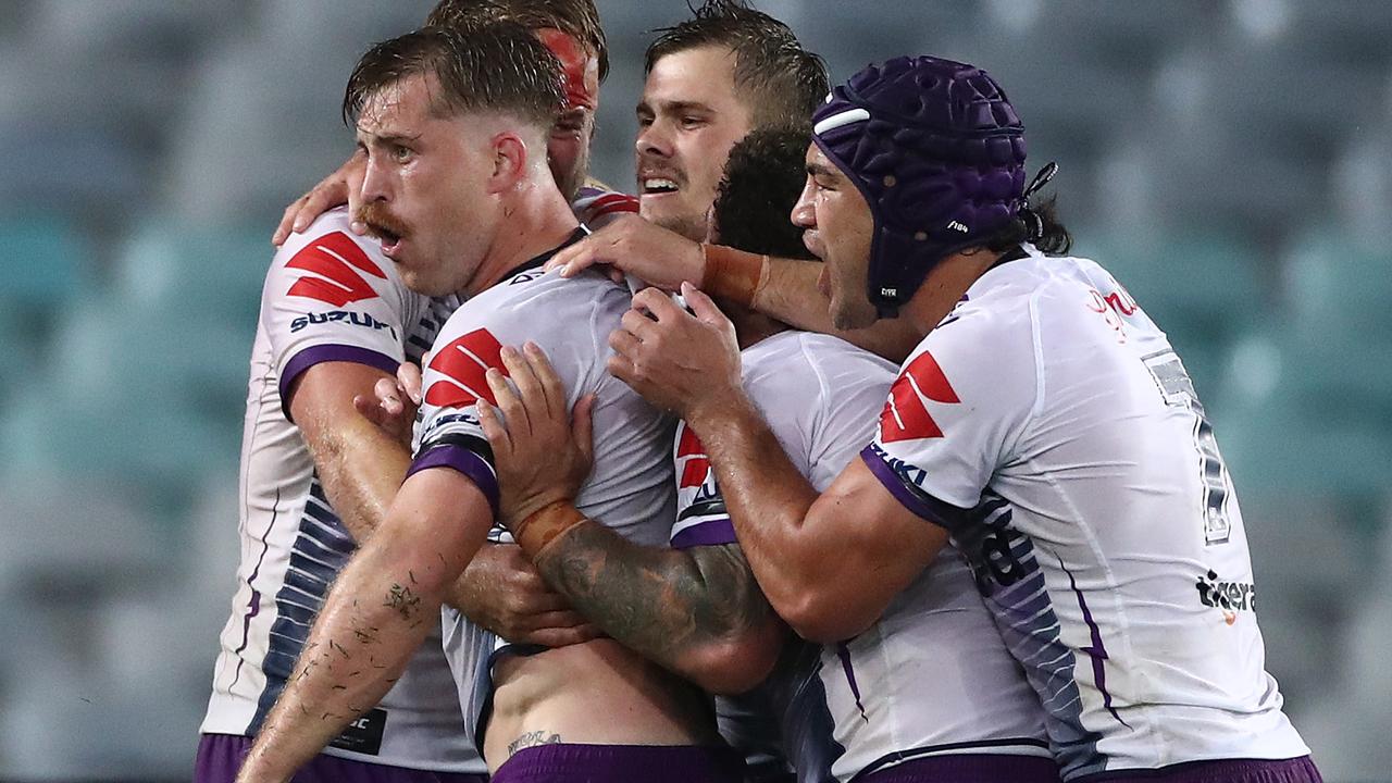 The Storm celebrate a try that snatched the lead from the Rabbitohs. (Photo by Cameron Spencer/Getty Images)