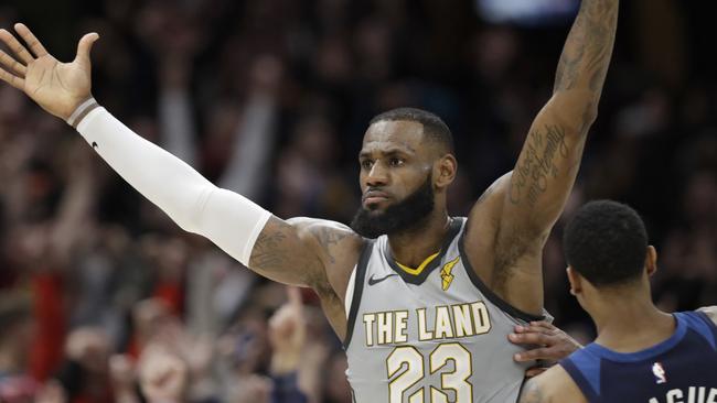 Cleveland Cavaliers' LeBron James celebrates after making the game-winning basket in overtime.