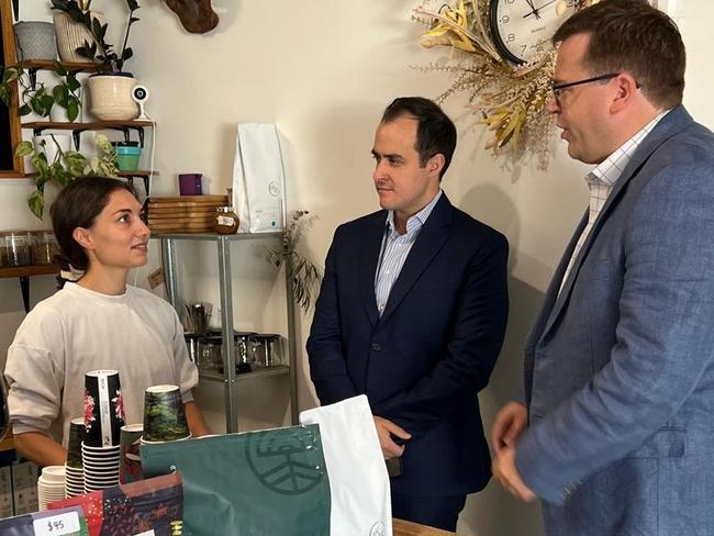 Vincent Tarzia and John Gardner speak with staff at the Hidden Leaf cafe in Campbelltown. Picture: Supplied