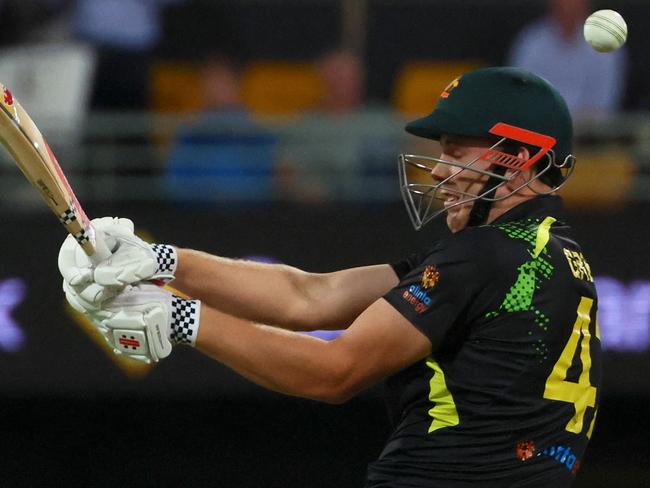 Australia's Cameron Green tries to play a shot during the second cricket match of Twenty20 series between Australia and West Indies in Brisbane on October 7, 2022. (Photo by Patrick HAMILTON / AFP) / -- IMAGE RESTRICTED TO EDITORIAL USE - STRICTLY NO COMMERCIAL USE --