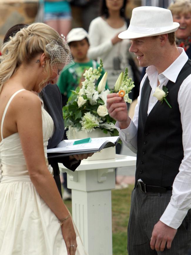 Adam Cooney presents Haylea MacCann with a Burger Ring at their wedding ceremony in 2009. Picture: Advertiser Library