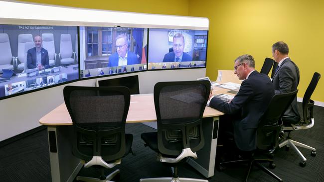 NSW Premier Dominic Perrottet (L) and DPC Secretary Michael Coutts-Trotter (R) before a virtual national cabinet meeting with state leaders, chief officers and Prime Minister Anthony Albanese. Picture: Toby Zerna/Office of NSW Premier