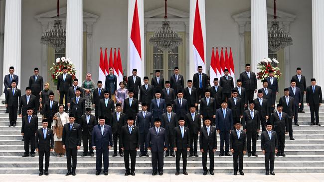 Indonesia's President Prabowo Subianto (front row centre) and Vice President Gibran Rakabuming Raka on his left pose with newly sworn-in cabinet ministers in front of the Presidential Palace in Jakarta. Picture: Bay Ismoyo / AFP