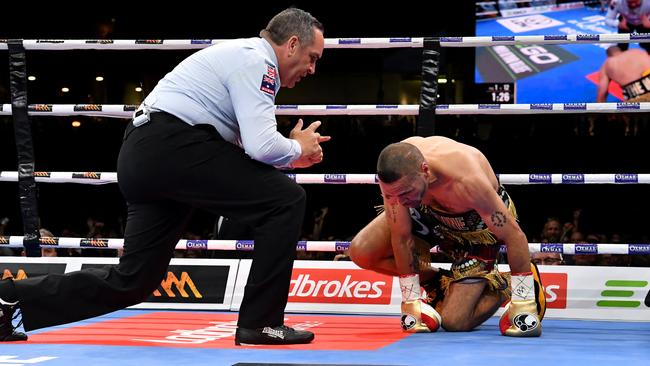 Anthony Mundine struggles to get up after copping a brutal punch from Jeff Horn.