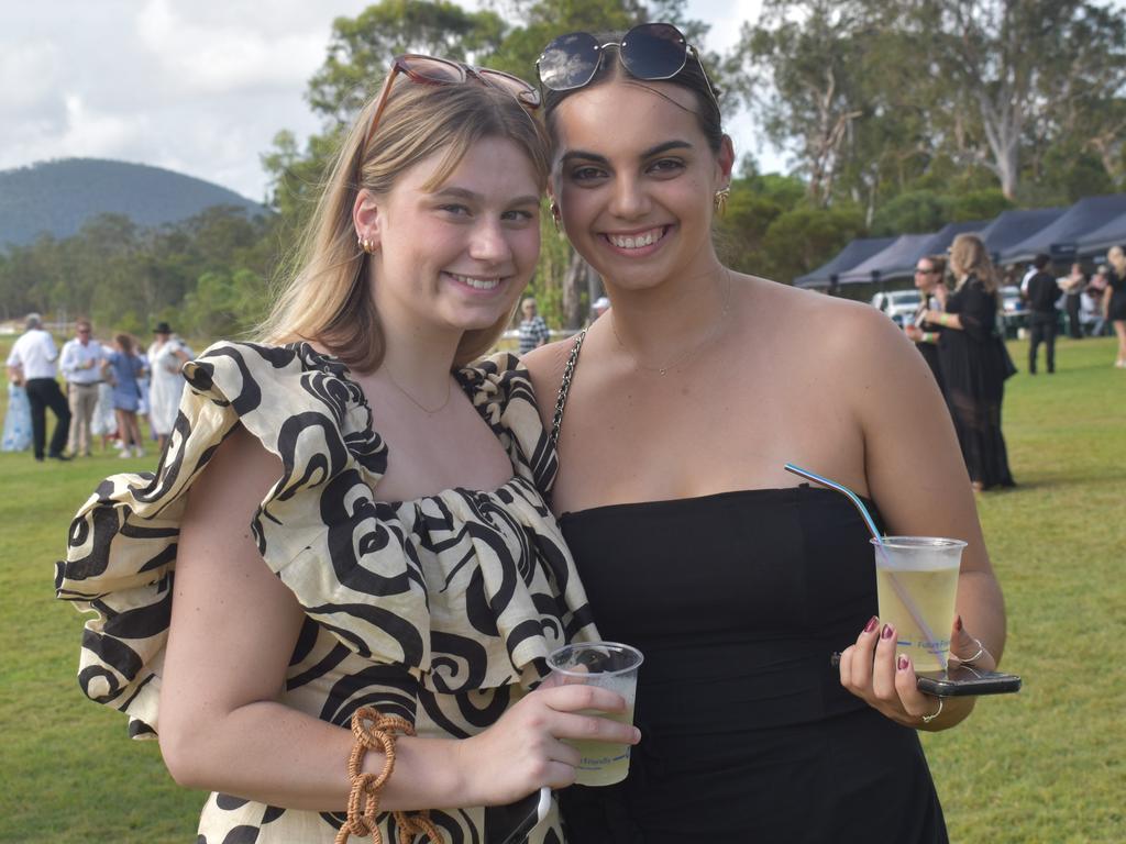 Bridie Dendle and Chelsea Schick at the Yeppoon Turf Club's Derby Day races at Keppel Park Racecourse on November 2, 2024.