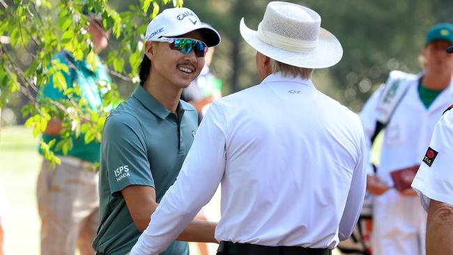 Min Woo Lee shakes hands with at Augusta National Golf Club Picture: Getty Images