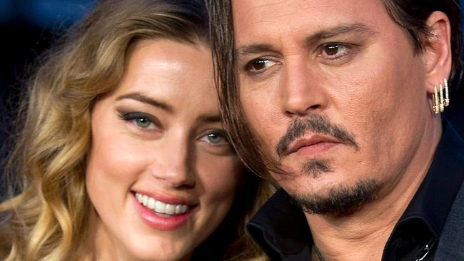 Depp and then-wife Amber Heard pose for photographers on the red carpet for the premiere of Black Mass on October 11, 2015. Depp is suing News Group Newspapers (NGN) over an April 2018 article in The Sun newspaper that claimed he had been violent to his former wife. Picture: Justin Tallis/AFP