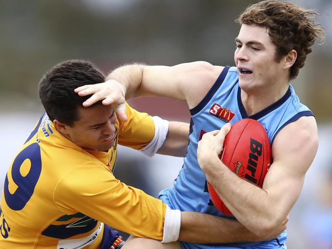 Woodville-West Torrens’ Matt Goldsworthy tackles Sturt’s Joshua Hone. Picture: SARAH REED