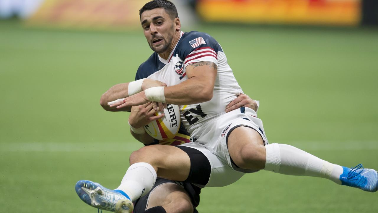 Canada’s Gordon McRorie throws United States’ Nate Augspurgeer to the ground.