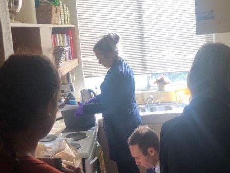 AFP officers searching Ms Smethurst’s kitchen. Picture: Supplied