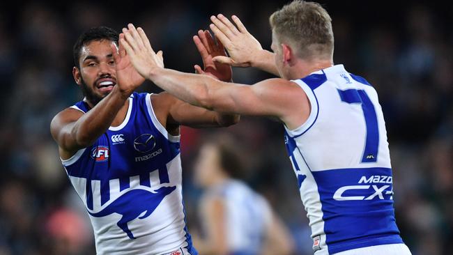 Tarryn Thomas, left, celebrates a goal with Jack Ziebell. Picture: AAP