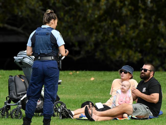 In NSW, police ask a family to move on at Rushcutters Bay park, Sydney. Picture: AAP