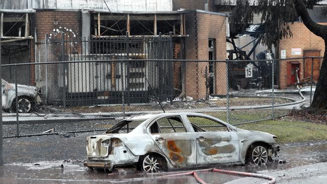 The fire tore through the factory and several cars. Picture: David Crosling