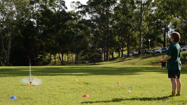 TAKING OFF: Kadina High School year 8 Endeavour STEM student Obi readies the launcher to test the class rockets.