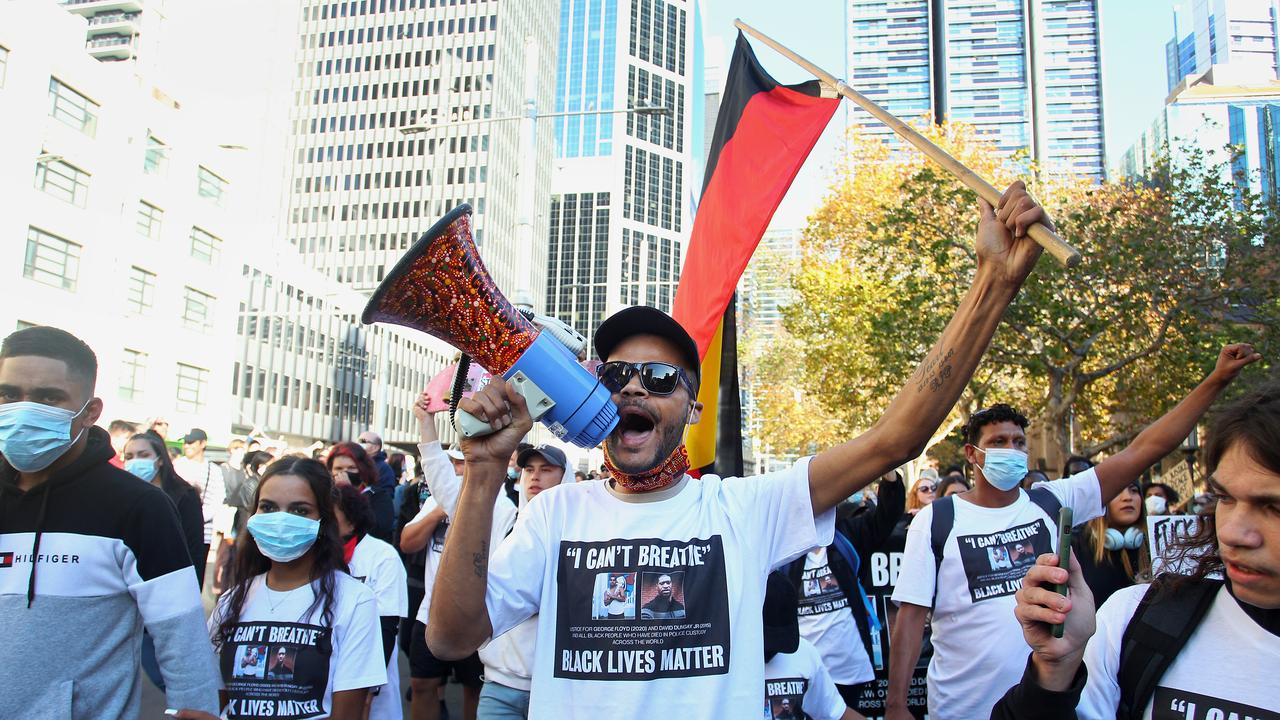 Protesters chanted and held placards at Town Hall during the protest march. Picture: Lisa Maree Williams/Getty Images