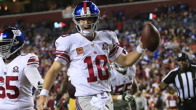 Eli Manning #10 of the New York Giants celebrates a touchdown.