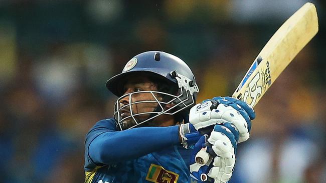 Tillakaratne Dilshan hits Mitchell Johnson for six at a World Cup match.