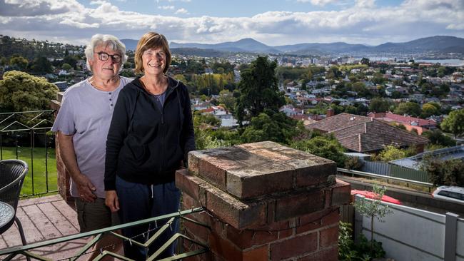 Michael and Ruth Hanlon, of Dynnyrne, have joined a group fighting to save their houses from being destroyed for a fifth lane on the Southern Outlet. Picture: Alastair Bett