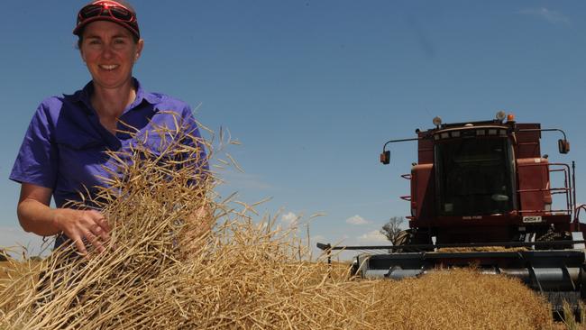 Heads up: Donna Dunn in a paddock of canola on her farm at Culcairn. Picture: Fiona Myers