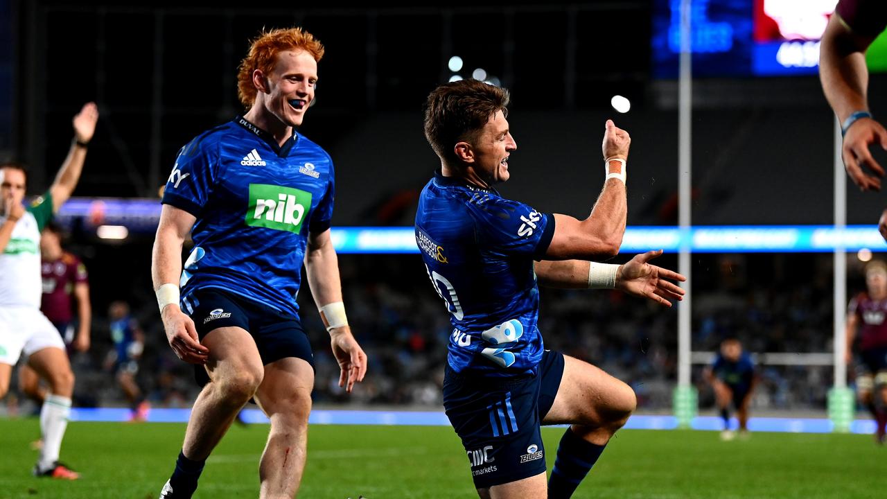 Blues star Beauden Barrett celebrates scoring a try against the Reds. Picture: Hannah Peters/Getty Images