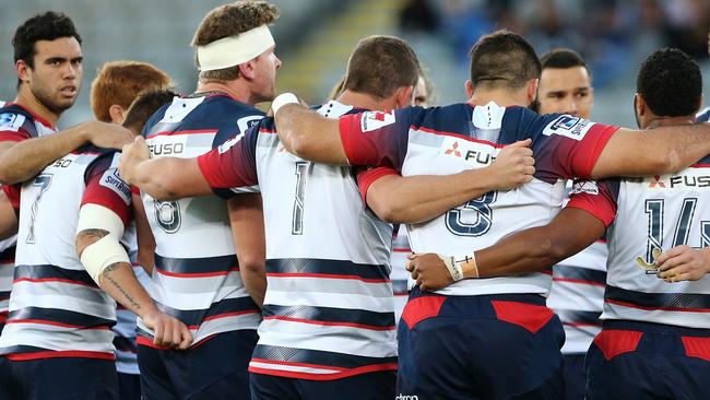 **FILE** A Saturday, April 30, 2016 image reissued Monday, April 10, 2017 of Rebels players at the start of the Round 10 Super Rugby match between the Blues and Melbourne Rebels at Eden Park in Auckland. The Western Force and Melbourne Rebels will learn within three days which of them is to be axed, Australian Rugby Union chairman Cameron Clyne says. It's part of a broader restructure of an unwieldy and unpopular Super Rugby competition format, which is to be slashed from 18 teams to 15 after this season, with two South African sides also to go. (AAP Image/David Rowland) NO ARCHIVING, EDITORIAL USE ONLY