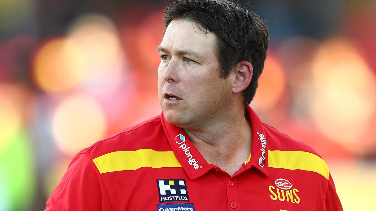 Suns coach Stuart Dew talks to players as they struggle against Port Adelaide.