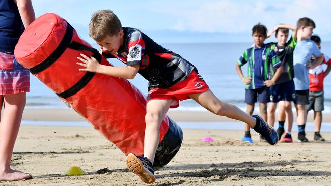 Under 10 Norths Rugby League Player Nate Contor tackles a bag at a training session at Blacks Beach. Picture: Tony Martin