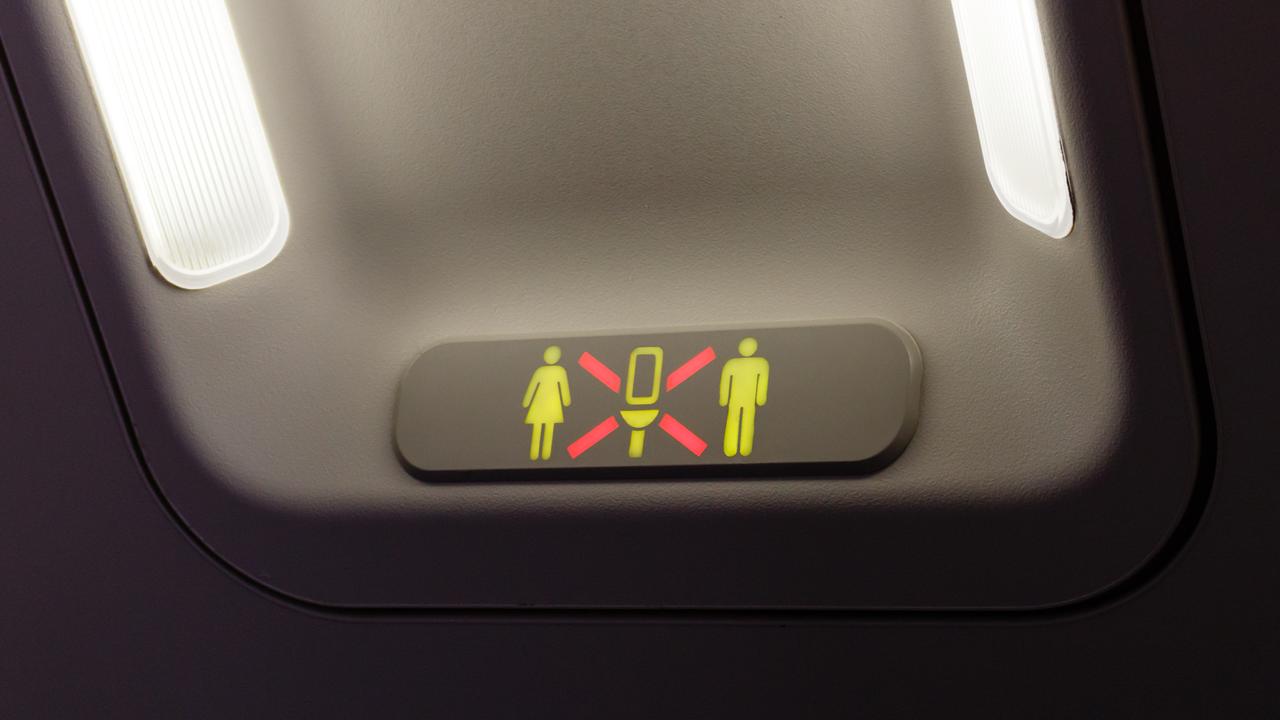 The middle seat should time their toilet visits with the person sitting in the aisle.