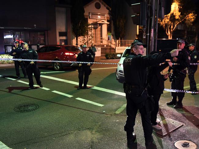 Police converge on a house in the inner-Sydney suburb of Surry Hills during counter-terrorism raids in which four men were arrested on July 29, 2017. Picture: AFP/William West