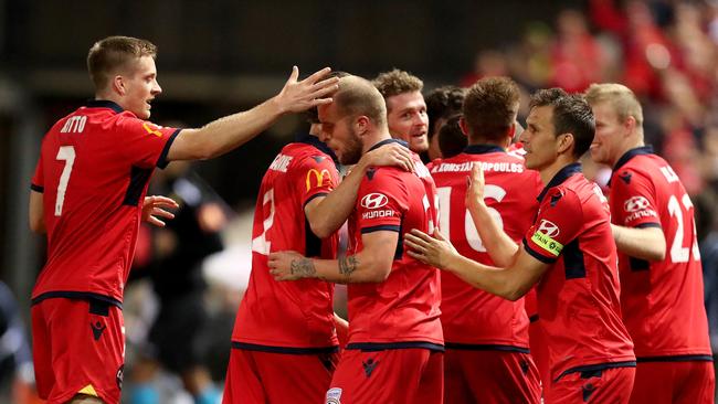 United players celebrate after scoring their second goal against the Phoenix.
