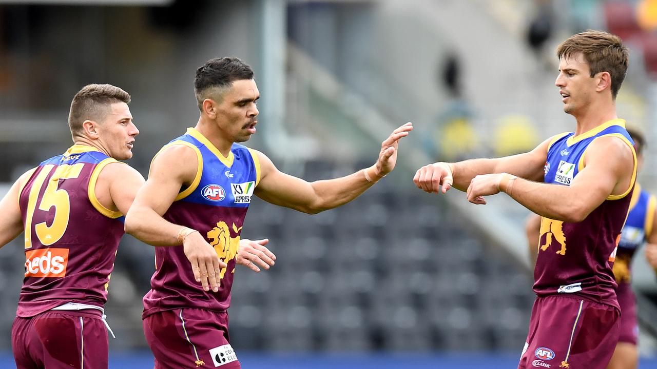 Brisbane Lions forward Charlie Cameron dominated the opening half, but a late surge from the Fremantle Dockers set up a thrilling finish.