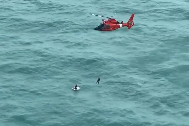 A video grab taken from footage released by the US Coast Guard shows a helicopter crew rescuing a man in the Gulf of Mexico