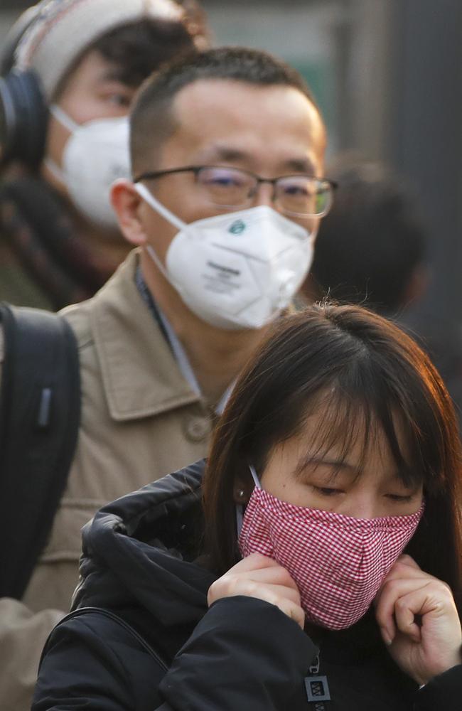 The air pollution in China causes much of the population to wear masks to filter the air. Picture: Andy Wong)