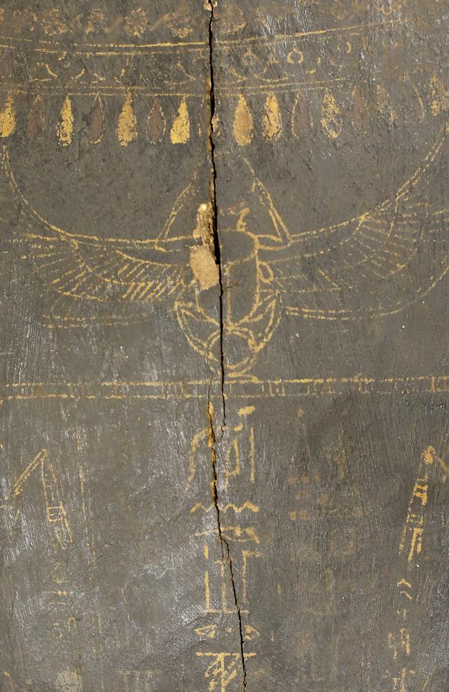 Egyptian hieroglyphics etched on top of the coffin.