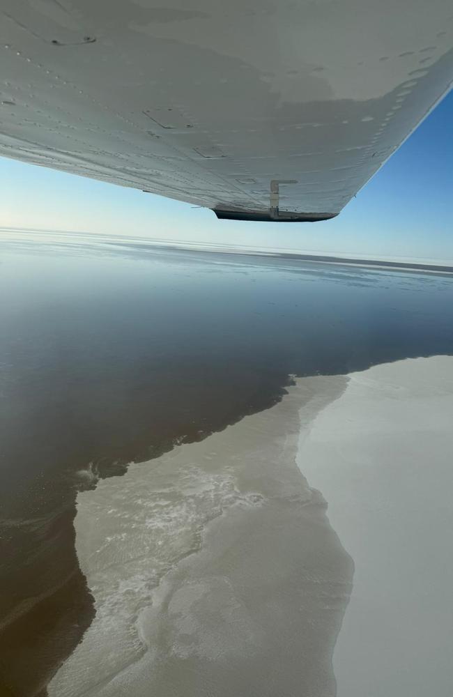 Water flows into Lake Eyre from Queensland's Channel Country. Picture: Birdsville Aviation