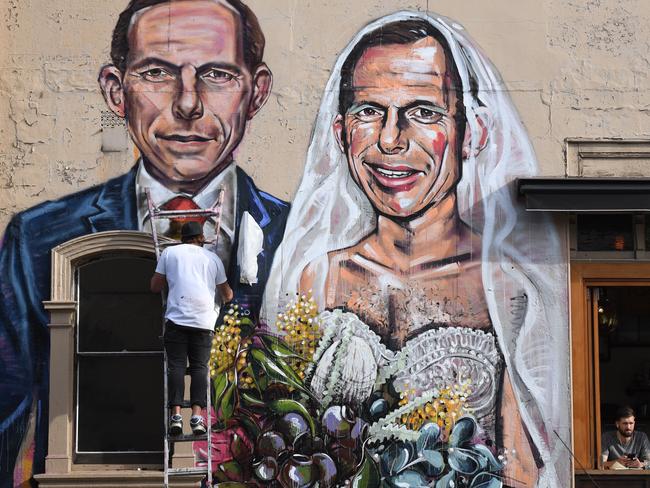 Same-sex marriage activists have targeted Mr Abbott before. Artist Scott Marsh painted a mural of the former PM getting married to himself at Hunters Corner in Redfern, Sydney. Picture: AAP