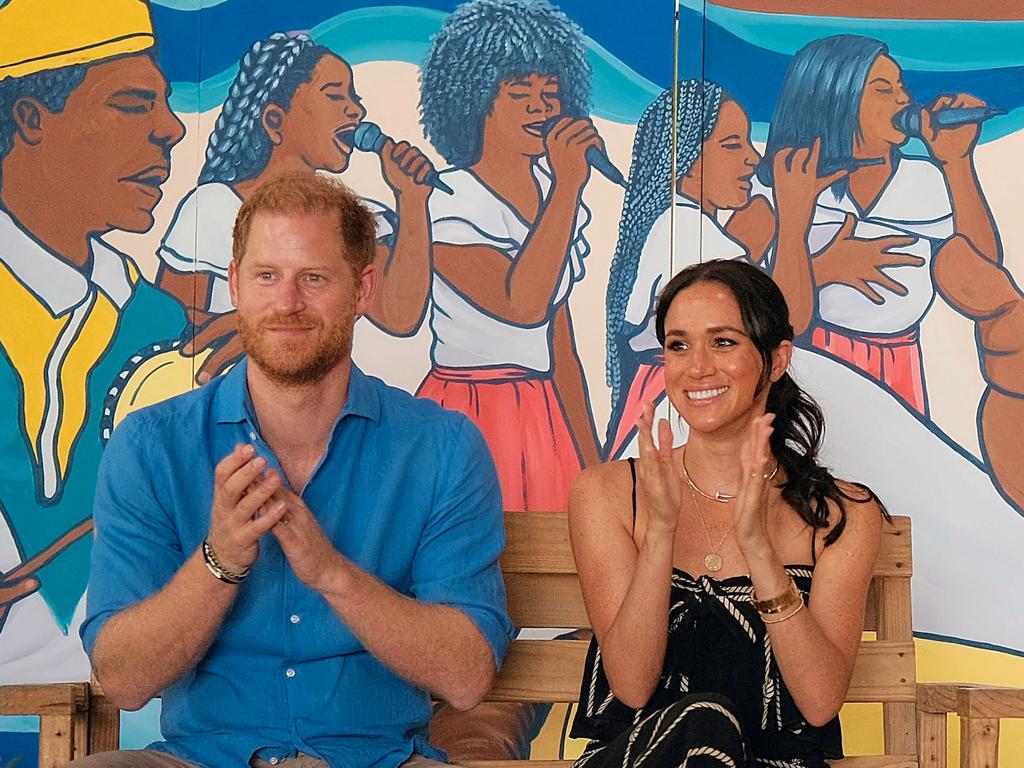 Prince Harry and his wife Meghan Markle clapping during a performance at La Boquilla drum school in Cartagena, Bolivar department, Colombia. Picture: Colombian Vice-Presidency / AFP