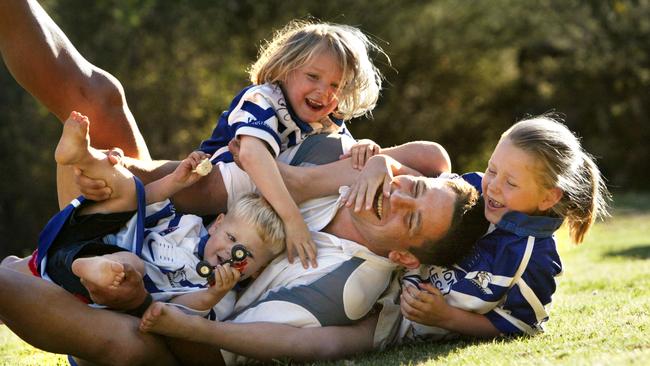 Then-Canterbury Bulldogs captain Steve Price at home with children Riley, 2, Kasey, 5, and Jamie-Lee, 7. Picture: Jeff Darmanin