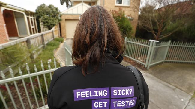 Government staff go door to door in Brunswick West to explain testing procedures. Picture: Getty Images