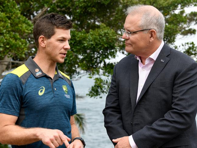 Australian cricket captain Tim Paine and Prime Minister Scott Morrison are seen during a New Year's reception for the Australian and New Zealand cricket teams at Kirribilli House in Sydney, Wednesday, January 1, 2020. (AAP Image/Bianca De Marchi) NO ARCHIVING