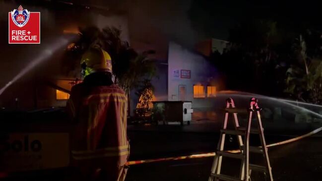 Firefighters battle building inferno