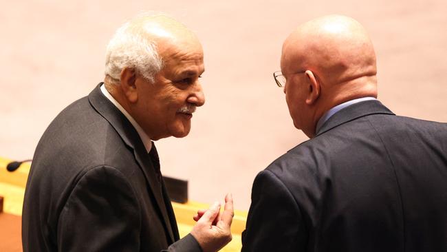 Palestinian Ambassador to the UN Riyad Mansour, left, greets Russian Permanent Representative to the UN Vassily Nebenzia prior to a Security Council vote to approve a resolution that demands all sides in the Israel-Hamas conflict allow the ’safe and unhindered delivery of humanitarian assistance at scale’. Picture: AFP